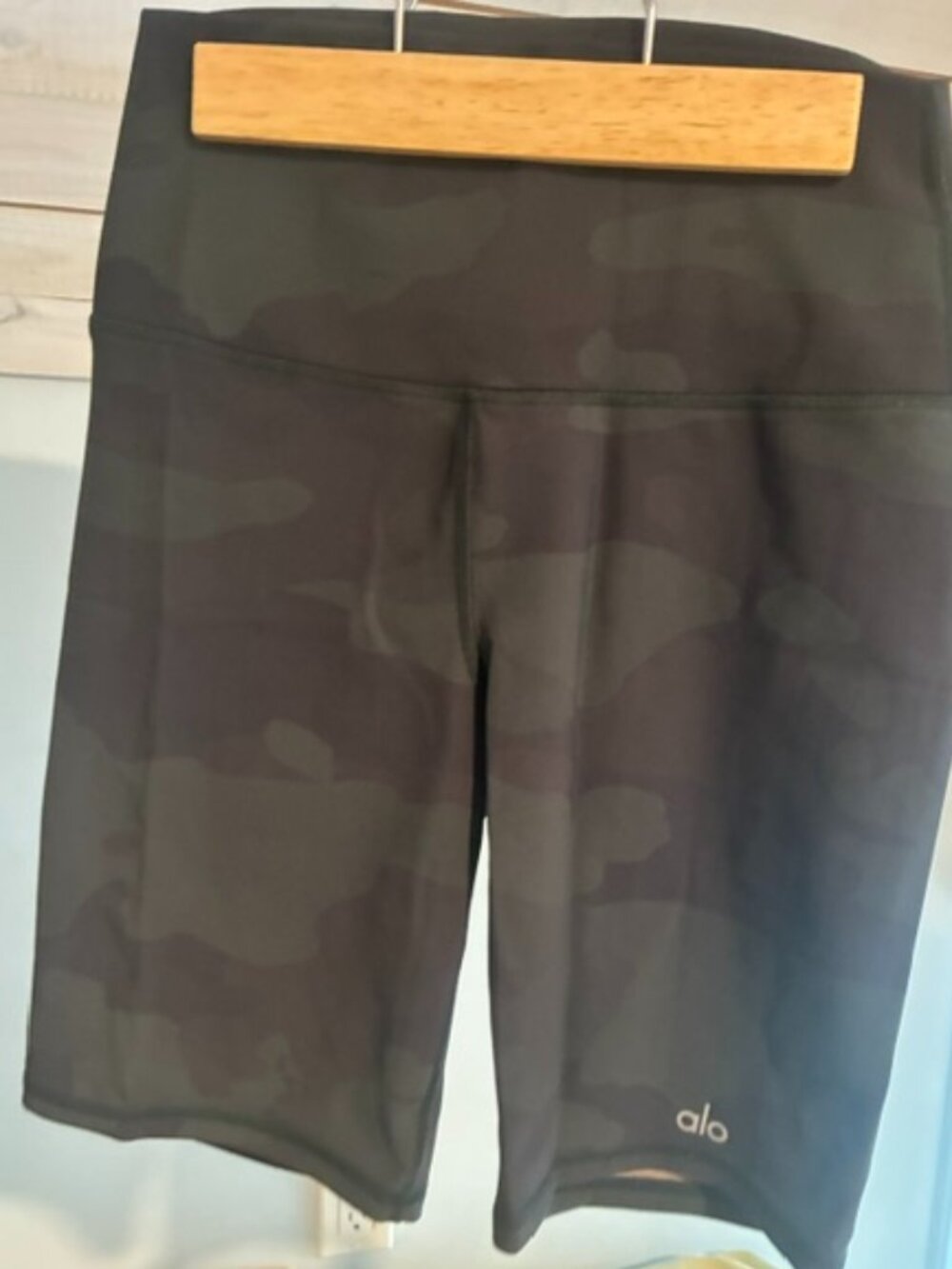 ALO women's green biker shorts in size S with a 7 inch rise.